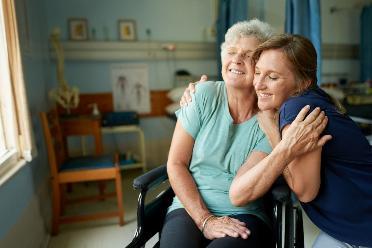 Shot of happy senior woman with her daughter at hospital